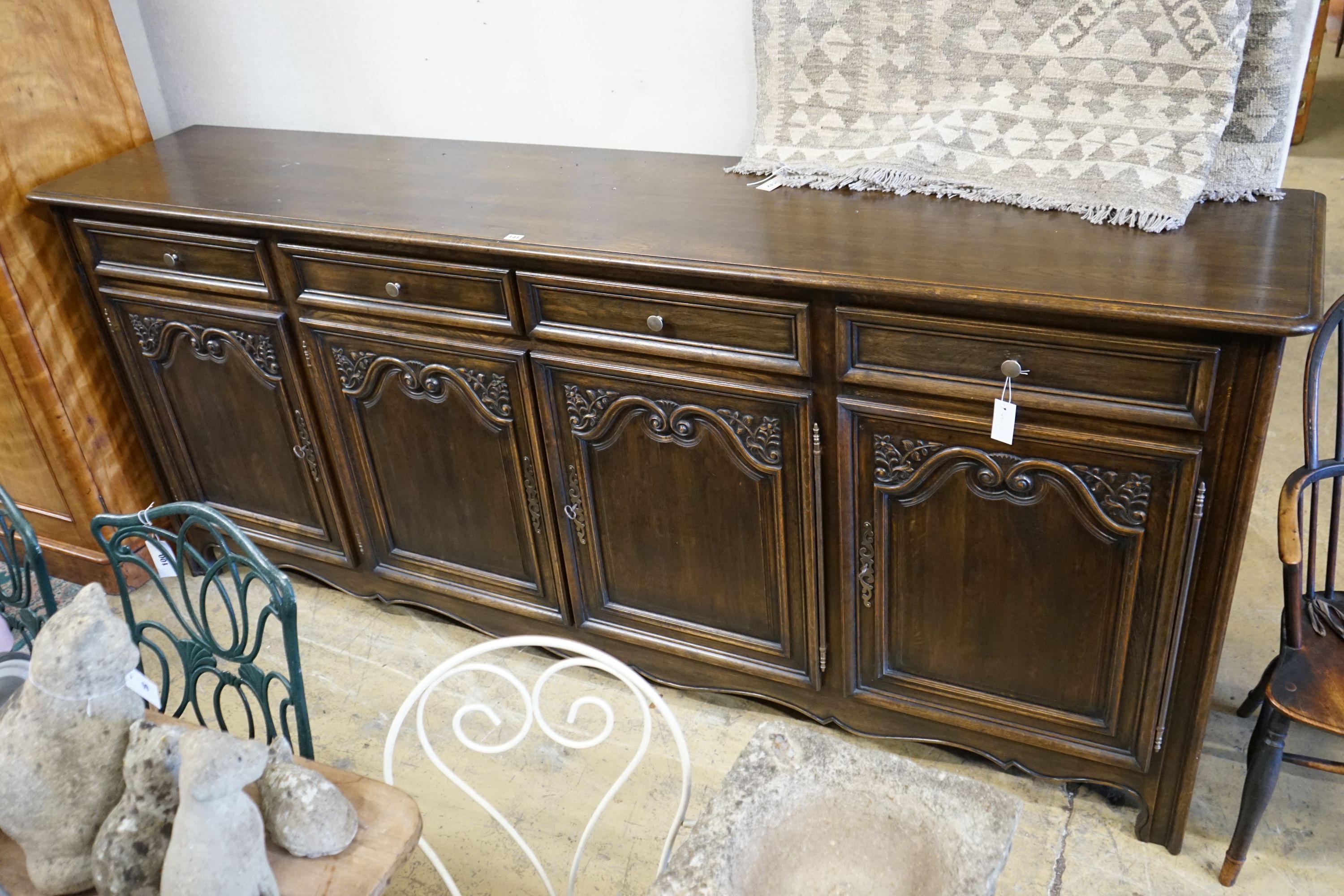 An 18th century style French oak four door buffet, length 260cm, depth 52cm, height 110cm